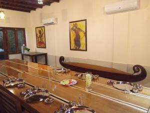 a bathroom with a counter with sinks and a mirror at Shantitheeram Ayurveda Lakeside Heritage Resort in Alleppey