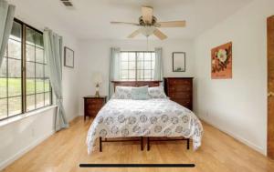 a bedroom with a bed and a ceiling fan at Casa Venado in Coarsegold