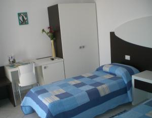 Posteľ alebo postele v izbe v ubytovaní Residence Olbia
