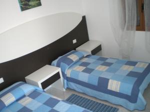 Posteľ alebo postele v izbe v ubytovaní Residence Olbia