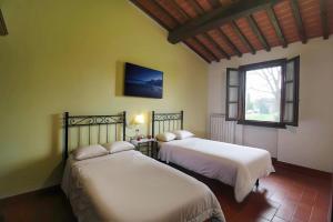 Postel nebo postele na pokoji v ubytování Corte Tommasi Residence