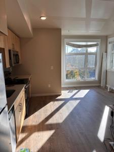 an empty kitchen with a large window in a room at Entire 1-Bedroom Apartment In Downtown Portland in Portland