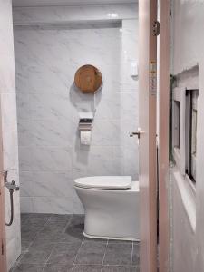 a bathroom with a white toilet in a room at Stay 2002 in Seoul