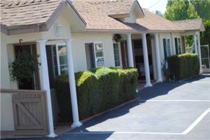 
a row of houses with trees at Rose Bowl Motel in Los Angeles
