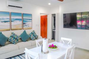 a living room with a couch and a table at The Palms Resort in Saint James