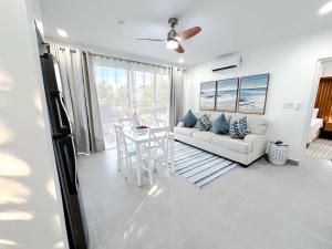 a living room with a couch and a table at The Palms Resort in Saint James