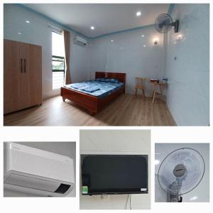 a room with a bed and a fan and a tv at Nhà nghỉ Trúc Mây in Ben Tre