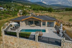 an aerial view of a house with a swimming pool at Villa Tasila 2 