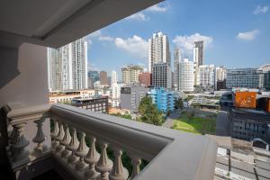 a balcony with a view of a city at Boulevard Hotel Bangkok Sukhumvit in Bangkok