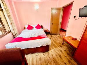 Postel nebo postele na pokoji v ubytování Hotel Green Orchid