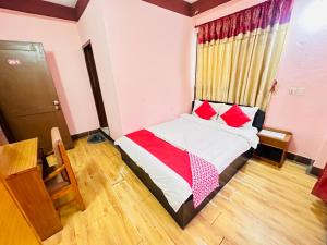 Postel nebo postele na pokoji v ubytování Hotel Green Orchid