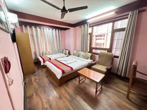 Tempat tidur dalam kamar di Hotel Green Orchid