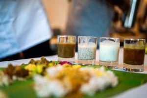 a group of three glasses of different types of food at Lilac Hotel Guruvayur in Guruvāyūr