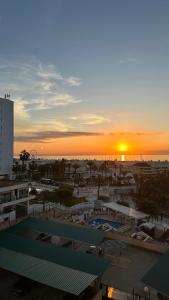 a view of the sunset from the roof of a building at Tamarindo 5 in Benalmádena