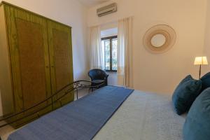 Posteľ alebo postele v izbe v ubytovaní Stazzo San Teodoro L'Olivastro Piscina Condivisa