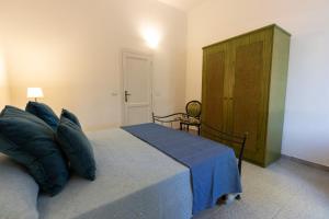 Posteľ alebo postele v izbe v ubytovaní Stazzo San Teodoro L'Olivastro Piscina Condivisa