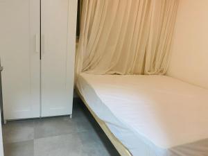 Ένα ή περισσότερα κρεβάτια σε δωμάτιο στο Apartment front the beach