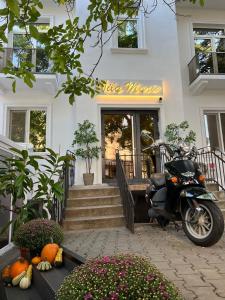 a scooter parked in front of a building at La Vila Maria in Bucharest