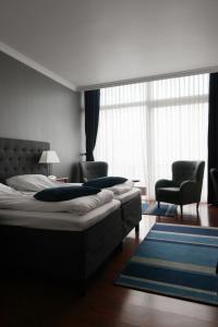 Postel nebo postele na pokoji v ubytování Helnan Marselis Hotel