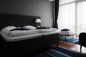 Postel nebo postele na pokoji v ubytování Helnan Marselis Hotel