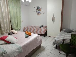 Postel nebo postele na pokoji v ubytování Nomentum House