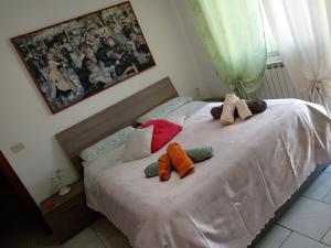 Postel nebo postele na pokoji v ubytování Nomentum House