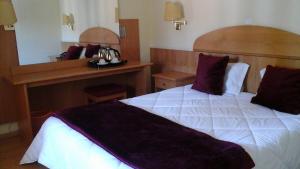 Cama ou camas em um quarto em Hotel Solneve