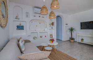 a living room with a couch and a table at Deluxe Apartments in Vantačići