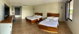 Postel nebo postele na pokoji v ubytování Lone Star Inn