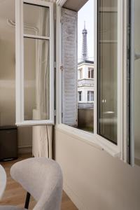 منطقة جلوس في The Carla Suite Eiffel Tower View