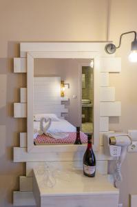 A bed or beds in a room at Agali Hotel