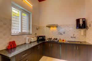 a kitchen with a sink and a counter top at Ludo Private Pool Villa, WiFi-Caretaker-Parking, North Goa in Baga