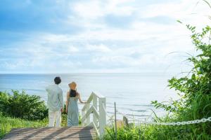 a couple looking out at the ocean at Shimoda Prince Hotel in Shimoda