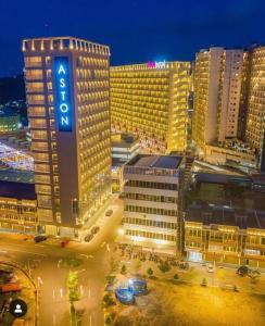 a view of a city at night with a hotel at 1 Bedroom Apartment nagoya thamrin city batam in Nagoya