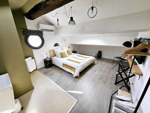 a bedroom with a large bed in a room at La Maison Grivolas in Avignon +74 photos