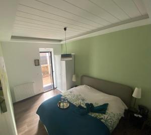 Posteľ alebo postele v izbe v ubytovaní De Tussenstop