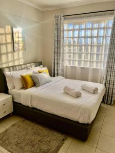 En eller flere senge i et værelse på The Cozy Haven