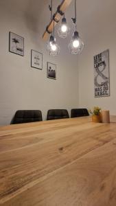 a conference room with a wooden table and chairs at homy Lakeside Symphony in Bregenz am Bodensee in Bregenz