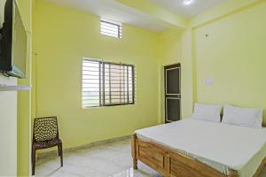 Un ou plusieurs lits dans un hébergement de l'établissement OYO Amargarh Valley Resort