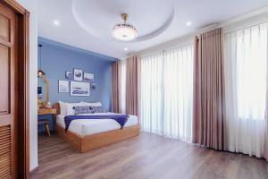 Postel nebo postele na pokoji v ubytování Phuc Lam Hotel & Apartment