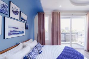 Postel nebo postele na pokoji v ubytování Phuc Lam Hotel & Apartment