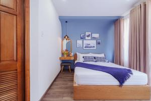 Postel nebo postele na pokoji v ubytování Phuc Lam Hotel & Apartment