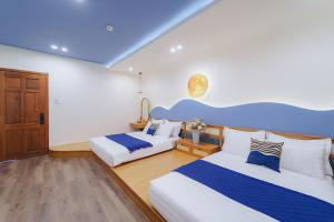 Postel nebo postele na pokoji v ubytování Phuc Lam Hotel & Apartment
