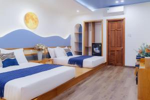 Postel nebo postele na pokoji v ubytování Phuc Lam Hotel & Apartment