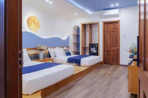 Postel nebo postele na pokoji v ubytování Phuc Lam Hotel & Apartment
