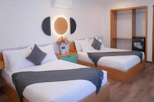 Postel nebo postele na pokoji v ubytování Phuc Lam Hotel & Apartment