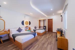 Postel nebo postele na pokoji v ubytování Phuc Lam Hotel & Apartment