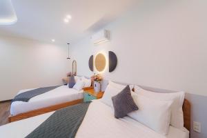 Postel nebo postele na pokoji v ubytování Phuc Lam Hotel & Apartment