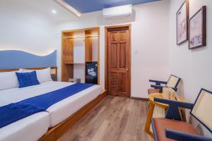 Postel nebo postele na pokoji v ubytování Phuc Lam Hotel & Apartment