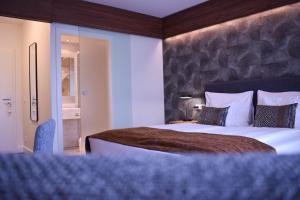 Ένα ή περισσότερα κρεβάτια σε δωμάτιο στο Landhotel Rügheim